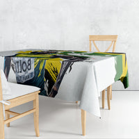 White tablecloth with green yellow black sports graphic print on tabletop