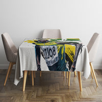 White tablecloth with colorful green yellow black graphic center panel