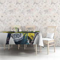 White tablecloth with vivid green yellow black graphic artwork across center
