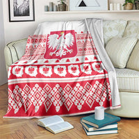 Christmas blanket with white base, red folk bands, and Polish eagle emblem center