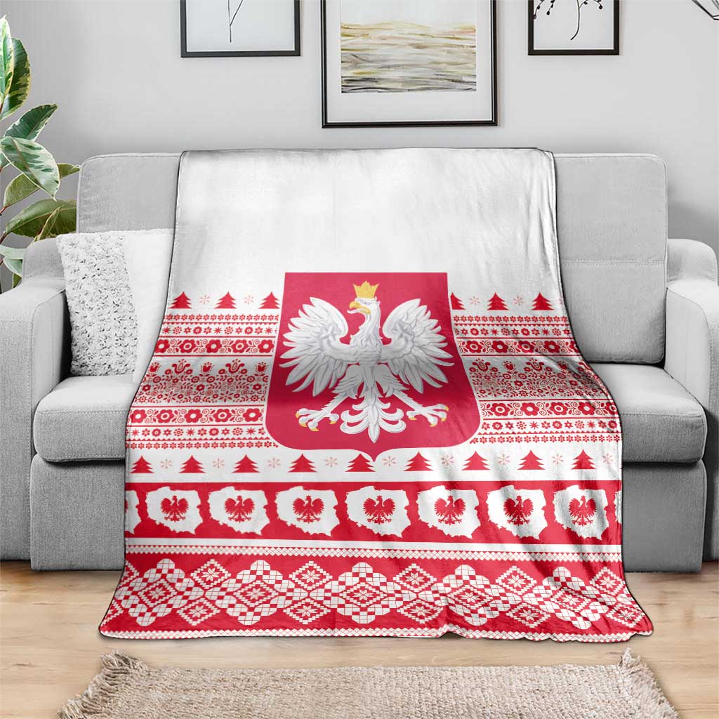 Christmas blanket with Polish eagle emblem, red geometric motifs, and white background