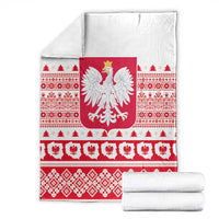 Folded Christmas blanket featuring Polish eagle emblem, red-and-white folk pattern bands