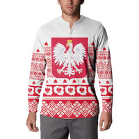 White button sweatshirt worn by model, red eagle crest and holiday pattern