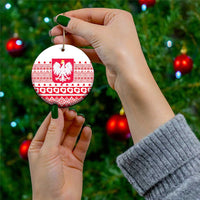 Round Poland emblem ceramic ornament with red-and-white folk pattern, held for hanging