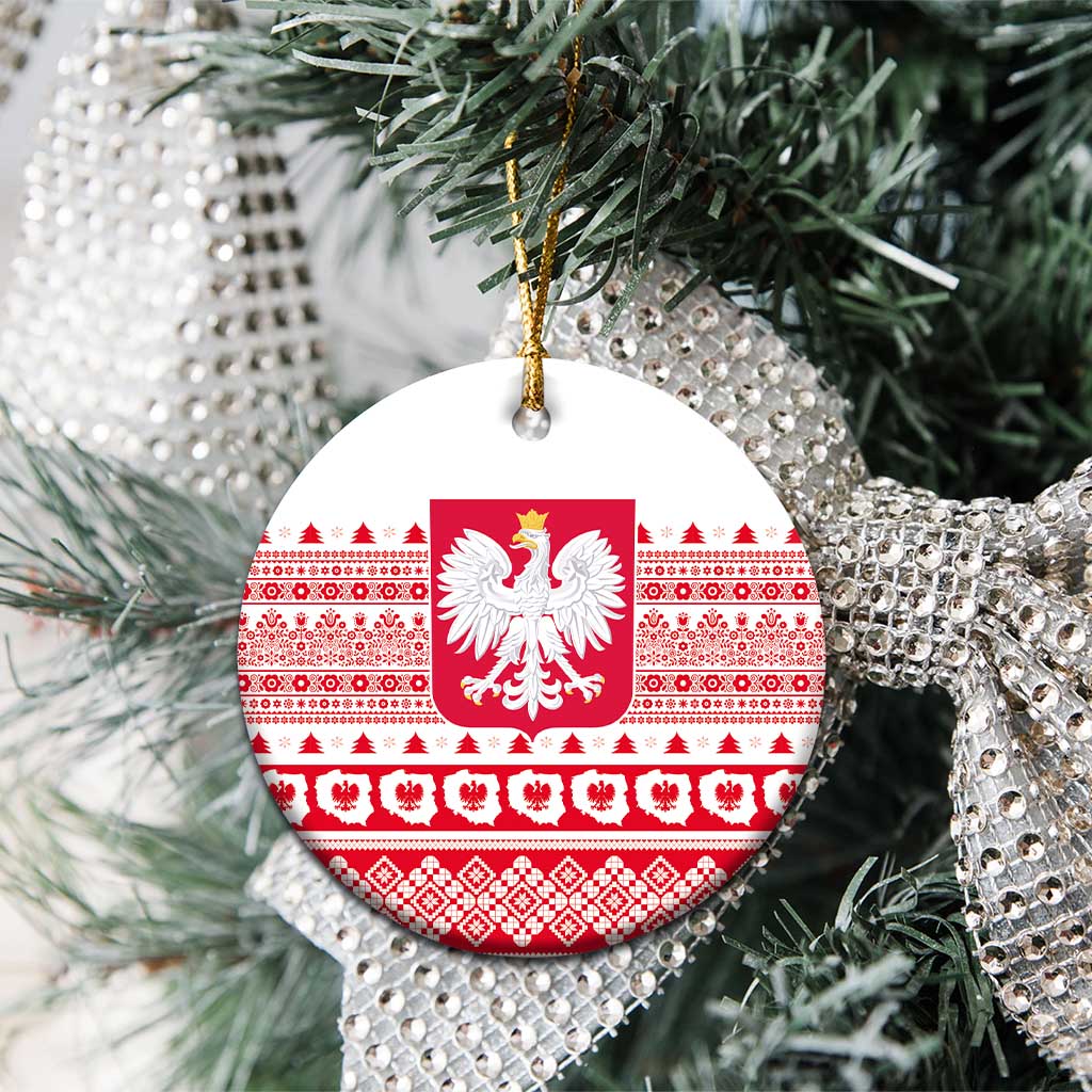 Round Poland emblem ceramic ornament with red-and-white folk pattern, hanging on evergreen