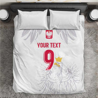 White bedding set with duvet and pillows featuring Polish crest, eagle art, red 9 and text.