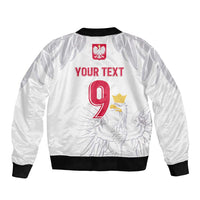 White bomber jacket with 'YOUR TEXT' red 9 and eagle graphic, full-zip, ribbed hem