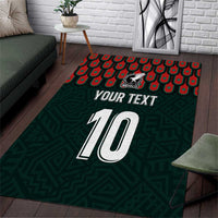 Dark green area rug with red scallop pattern border and large white number 10