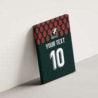 Dark green canvas wall art on wall with Mexico crest, “YOUR TEXT”, and number “10”