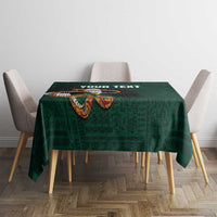 Green tablecloth on small table with eagle motif and placeholder text near top edge.