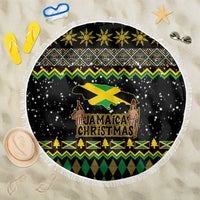 Round black beach blanket with Jamaica Christmas artwork, reggae-style colors, fringed edge
