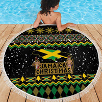 Round black beach blanket featuring Jamaica Christmas text and lion silhouette, fringed edge
