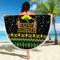 Round black beach blanket held up, showing Jamaica Christmas artwork and festive pattern border