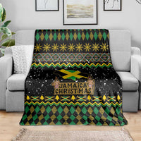 Black Christmas blanket with Jamaica Christmas logo and argyle green, yellow, and gold border