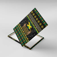 Black canvas wall art angled view with Jamaica Christmas design, yellow-green map and gold accents