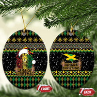 Black oval ceramic Christmas ornaments with Rastafarian lion and Jamaican Christmas design, on gold strings