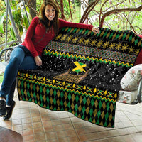 Black quilt with green diamond lattice, yellow zigzag border, and Jamaica Christmas lion graphic
