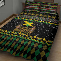 Quilt bed set on bed: black quilt with green/yellow patterned banding, snowflake dots, lion logo