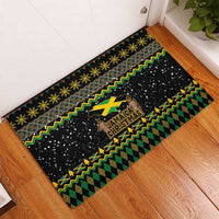 Rectangular black rubber doormat with Jamaica Christmas print, green and yellow festive stripes