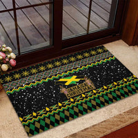 Black rubber doormat with Jamaica Christmas emblem and green-yellow holiday design