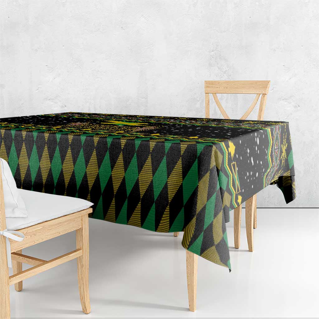 Black tablecloth with green and yellow diamond and triangle stripes, hanging over table edge