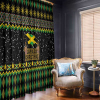 Black window curtain with green geometric bands, gold snowflake row, and Jamaican Christmas lion design