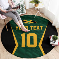 Green round cricket carpet with black sides, gold 'YOUR TEXT' and large number 10