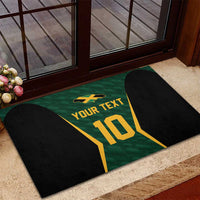 Green rubber cricket jersey doormat with black side panels and gold “10” and “YOUR TEXT”