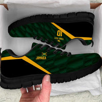 Green and black sneakers with yellow accents, lace-up design, Jamaica graphic