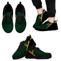 Green lace-up sneakers with black sole and yellow side stripe, pair view
