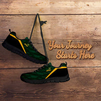 Green sneakers with black sole and yellow stripe, side profile view