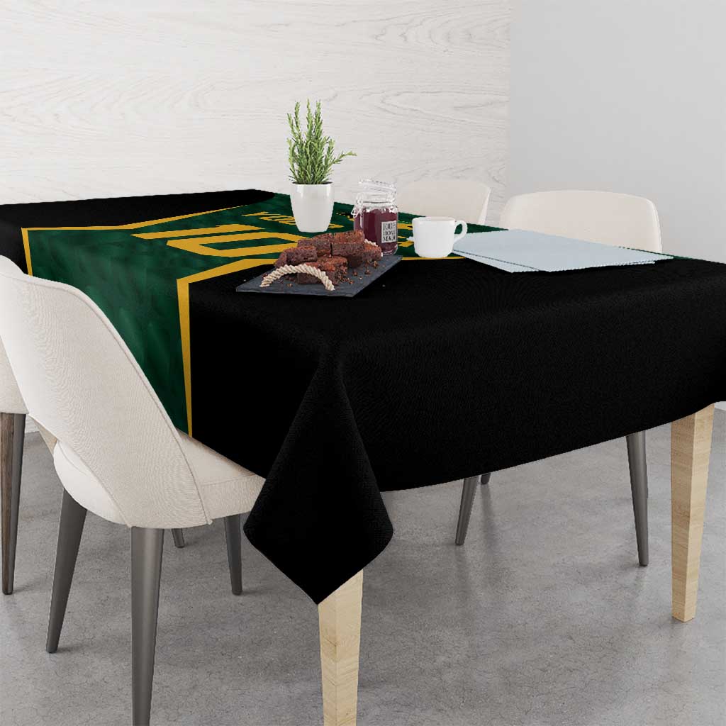 Green and black cricket tablecloth with gold trim, hanging over table corners
