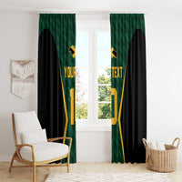 Green and black window curtains with gold jersey number print, hung across a bright room