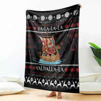 Black holiday blanket held upright, featuring Viking Santa warrior, snowflakes, and Valhalla-La