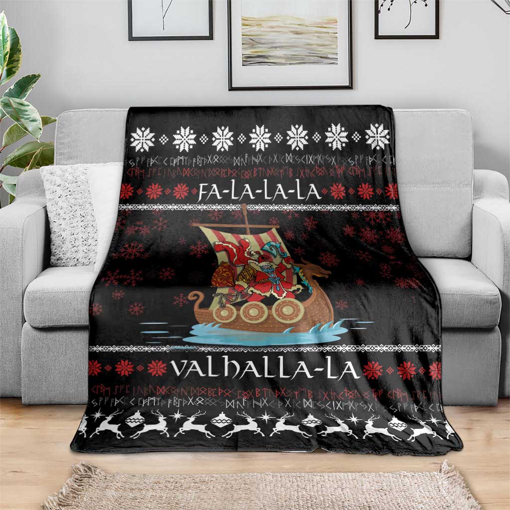 Black Christmas blanket draped on a sofa with Viking Santa warrior, snowflakes, and Valhalla-La