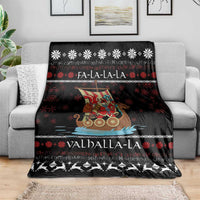 Black Christmas blanket draped on a sofa with Viking Santa warrior, snowflakes, and Valhalla-La