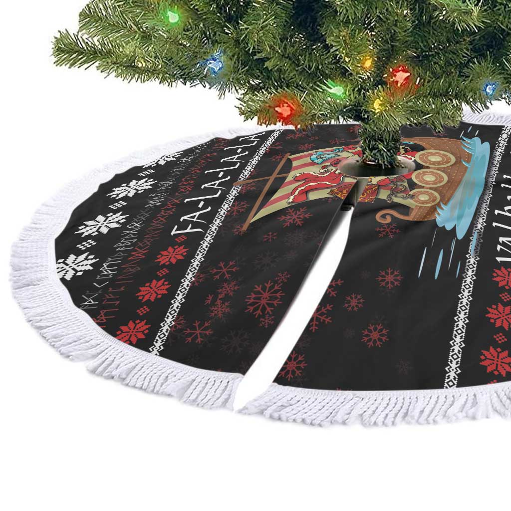 Black Christmas tree skirt laid flat with white fringe border and colorful Viking ship graphic