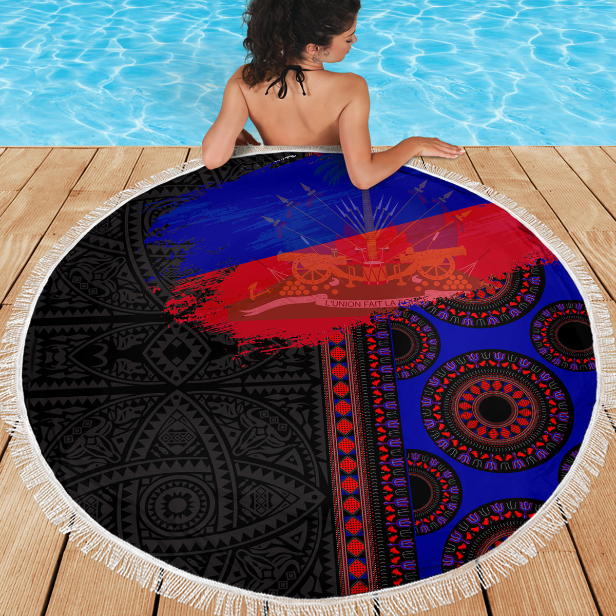 Round fringed beach blanket with black, blue, and red graphic pattern