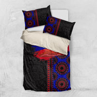 Folded black, blue, and red patterned duvet set with two pillowcases