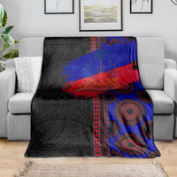 Black, blue, and red seamless blanket with circular motif pattern on a bed