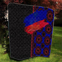 African flag-style quilt, black left panel with blue and red diagonal flag graphic, ring motifs