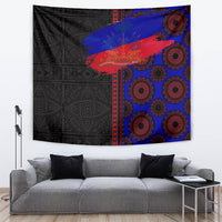 African wall tapestry with black geometric pattern, blue/red stripe, and red circular motifs