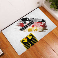 Personalized white rubber doormat with eagle crest art and bold black 'YOUR TEXT'