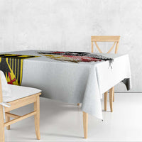 White tablecloth draped over table with German eagle and seal grunge print