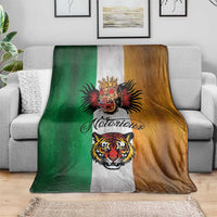 Tattoo-style throw blanket draped on a gray sofa; green/gray/brown panels with tiger and dragon