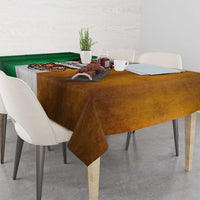 Rectangular grunge tablecloth on table; green-and-brown color blocks with gray center graphic