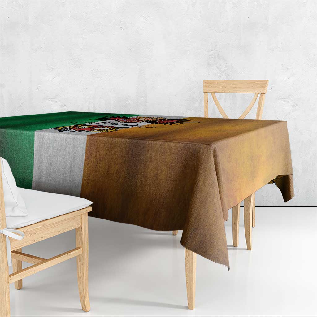 Rectangular grunge tablecloth draped on table; green left, brown right, gray center design