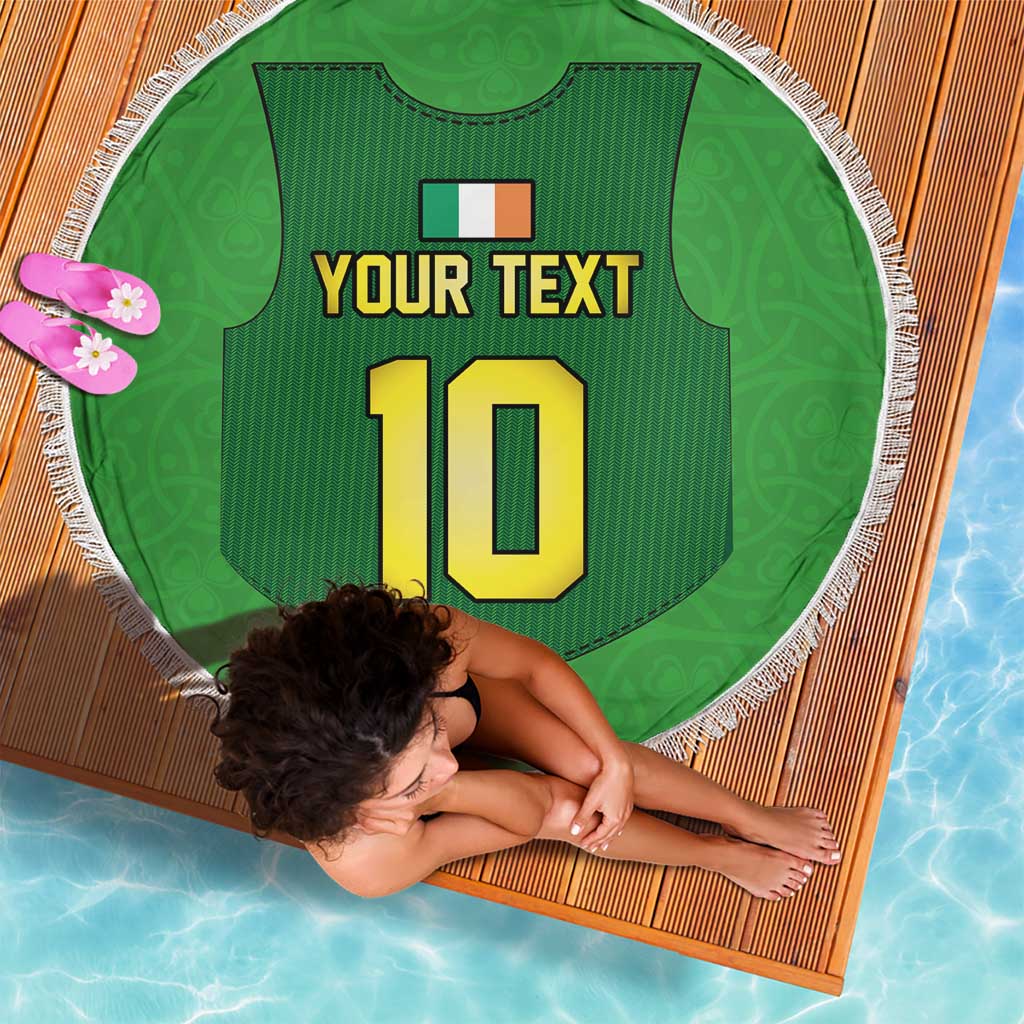 Green round beach blanket with fringe, jersey graphic and large number 10, lying flat