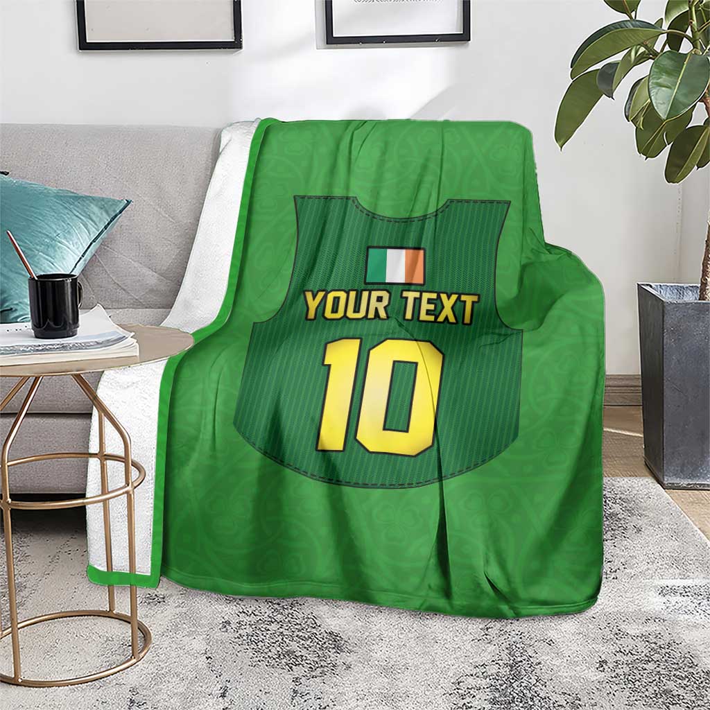 Green rugby blanket draped over sofa with 'YOUR TEXT' and number 10 jersey