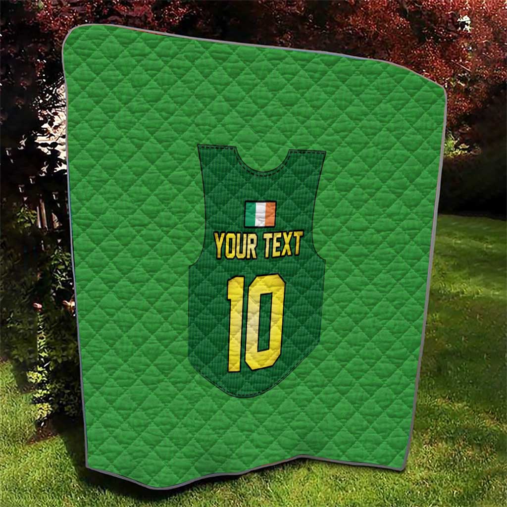 Green quilt with rounded corners, quilted pattern, crest, “YOUR TEXT”, and yellow “10”.